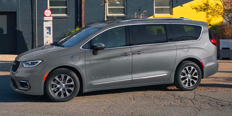 White Chrysler Pacifica Plug-in Hybrid minivan charging
