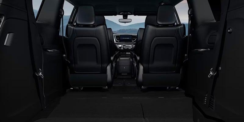 View of the third-row seating area of a Chrysler minivan with seats folded down