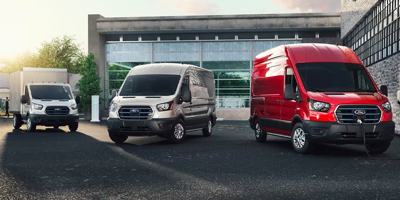 Ford E-Transit vans, including one red van