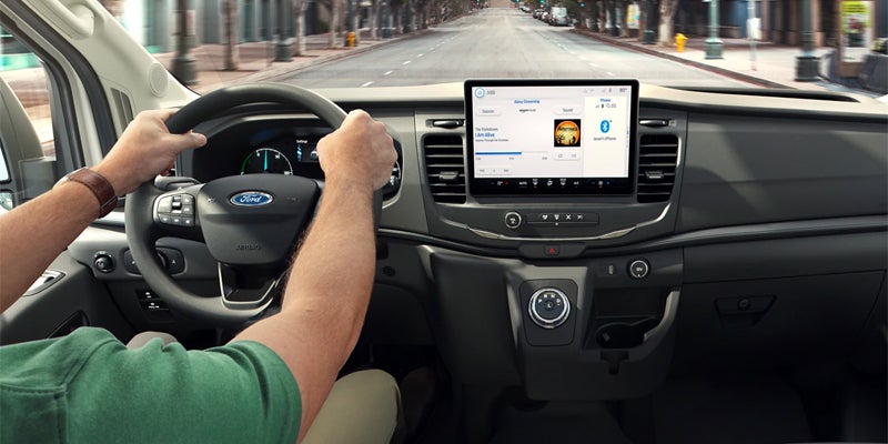 person driving a ford e-transit van