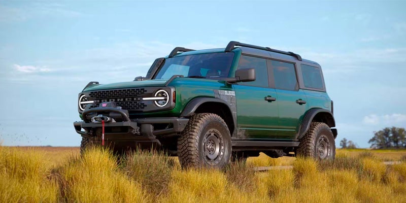 ford bronco with a winch on a field