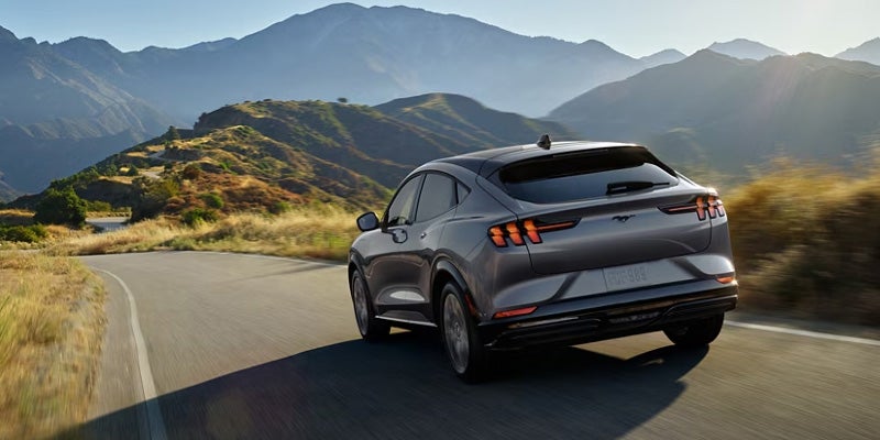 Ford Mustang Mach-E driving on a mountain road