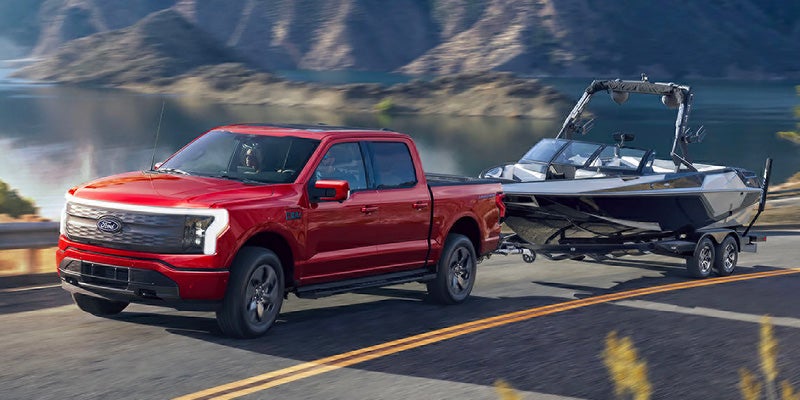 ford f-150 lightning towing a boat