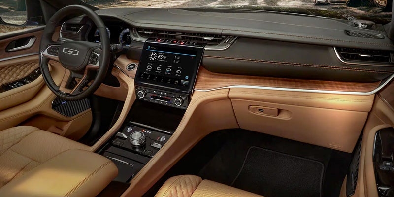 Jeep SUV interior with touchscreen and wood accents