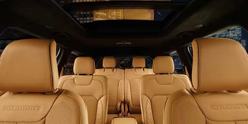  Interior view of a Jeep Grand Cherokee L's tan leather seats