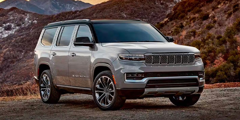 Grey Grand Wagoneer SUV on a city street