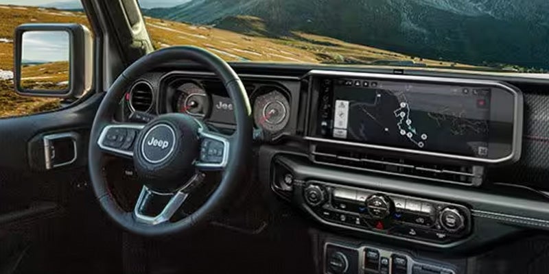 A view from the driver's seat of a Jeep Wrangler's infotainment system