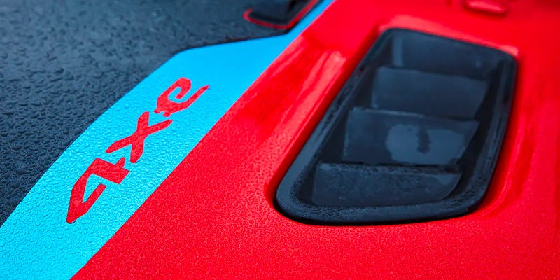 Close-up of the red and blue 4xe decal on the Jeep Wrangler hood vent