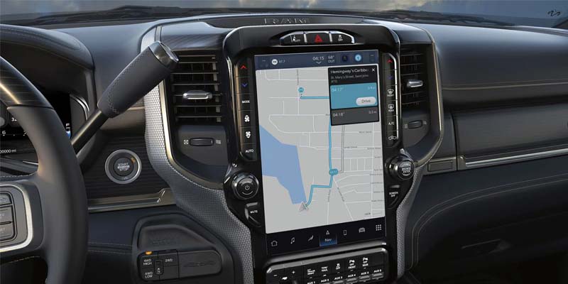 Close-up of a Ram truck's interior showing a large vertical touchscreen navigation display