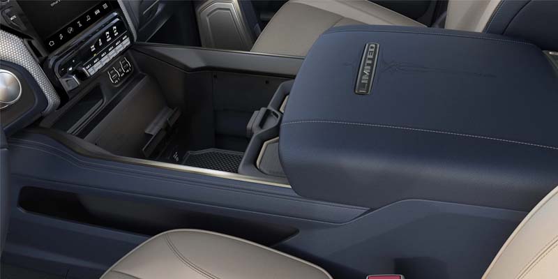 View of a large, upholstered center console in a Ram truck interior