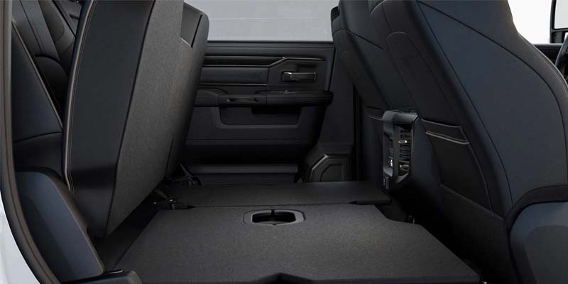 Rear seats folded up to create a flat load floor in a Ram truck